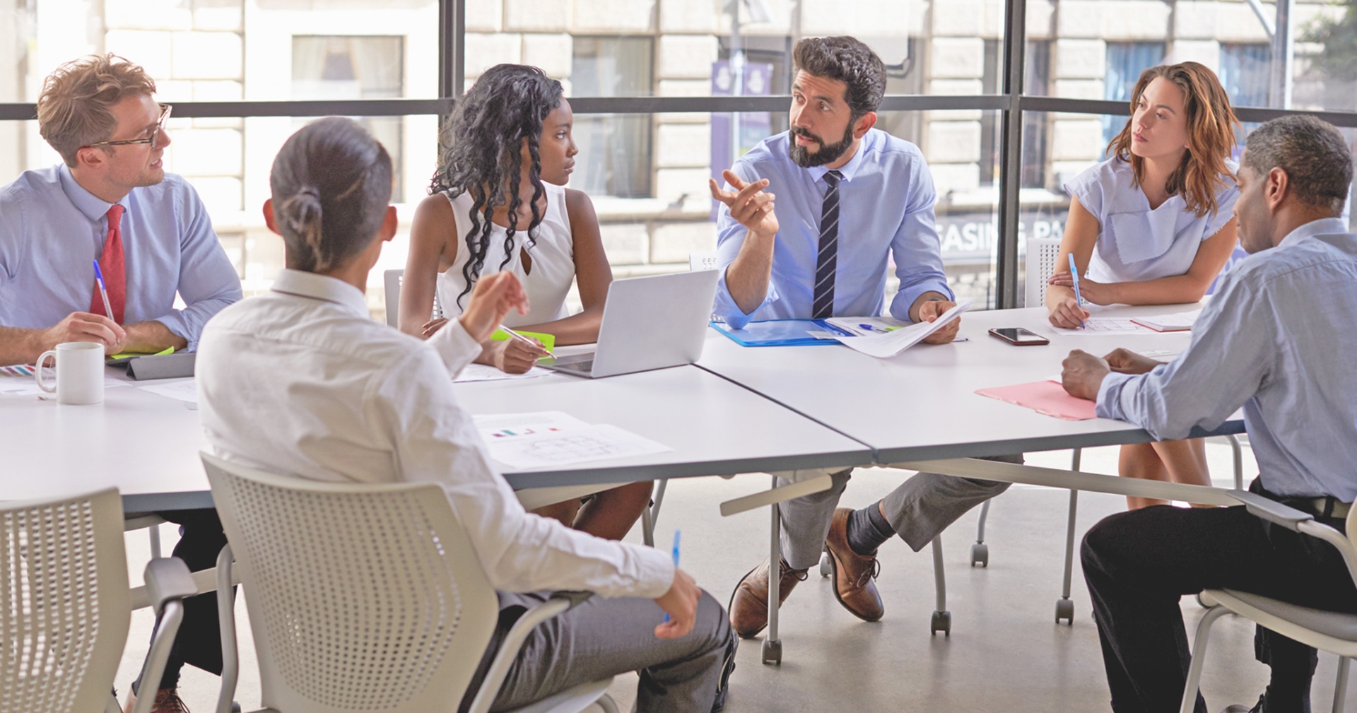 Professionals collaborating at a hiring event
